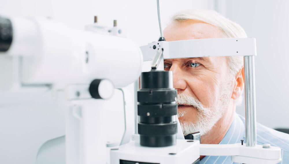 Senior male getting an eye exam